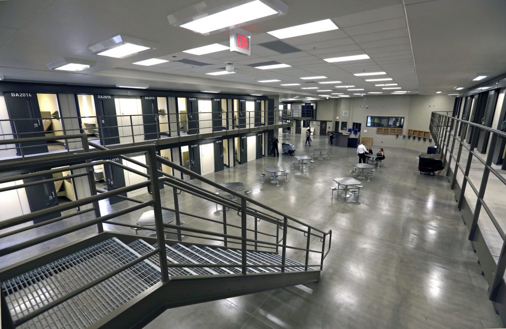 FILE – This June 1, 2018, file photo shows a housing unit in the west section of the State Correctional Institution at Phoenix in Collegeville, Pa. The first phase of transferring more than 2,500 inmates from the 89-year-old state prison at Graterford to the long-delayed $400 million SCI Phoenix prison began Wednesday, July 11, 2018, according to the Pennsylvania Department of Corrections, which plans to bus hundreds of inmates a day to the new prison facility about a mile down the road until all are relocated. (AP Photo/Jacqueline Larma, File)